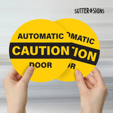 Load image into Gallery viewer, Bulk Case of 250 Sets - 2pk Caution Automatic Door Stickers, Double Sided Weatherproof Vinyl, 6&quot; Diameter