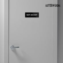 Load image into Gallery viewer, Bulk Case of 250 Signs - Not An Exit Sign, Durable ABS Plastic with Full Adhesive Backing, Sign for Door or Wall, 2x6"
