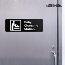 Load image into Gallery viewer, Bulk Case of 100 Sets - Baby Changing Station Sign, Durable ABS Plastic with Full Adhesive Backing, Sign for Restroom Door or Wall, 3x9"