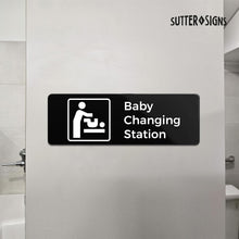 Load image into Gallery viewer, Bulk Case of 100 Sets - Baby Changing Station Sign, Durable ABS Plastic with Full Adhesive Backing, Sign for Restroom Door or Wall, 3x9"