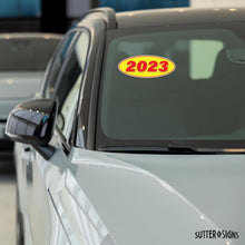 Load image into Gallery viewer, Bulk Case of 75 Sets - 2023 Car Model Year Windshield Stickers | 14" x 5.5" Oval Stickers for Car Dealerships, Vehicle Windshields (Pack of 12)