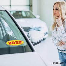 Load image into Gallery viewer, Bulk Case of 63 Sets - 2022 Car Model Year Windshield Stickers | 14" x 5.5" Oval Stickers for Car Dealerships, Vehicle Windshields (Pack of 12)