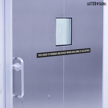 Load image into Gallery viewer, Bulk Case of 150 Sets - This Door To Remain Unlocked When Building Is Occupied Sign Adhesive Decal Sticker 2x26 inches