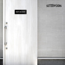 Load image into Gallery viewer, Bulk Case of 250 Signs - Not An Exit Sign, Durable ABS Plastic with Full Adhesive Backing, Sign for Door or Wall, 2x6"