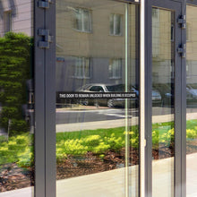 Load image into Gallery viewer, Bulk Case of 150 Sets - This Door To Remain Unlocked When Building Is Occupied Sign Adhesive Decal Sticker 2x26 inches (Pack of 2)