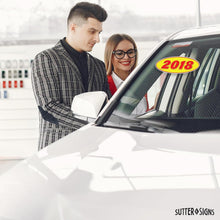 Load image into Gallery viewer, Bulk Case of 100 Sets - 2018 Car Model Year Windshield Stickers | 14" x 5.5" Oval Stickers for Car Dealerships, Vehicle Windshields (Pack of 12)